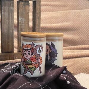 Eight ounce hand poured soy candles in glass containers w/bamboo lids.